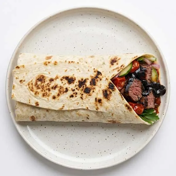 Black Tahini Beef Kabab Wrap with Smoked Cherry Tomato Coulis